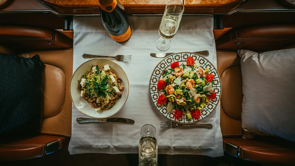 Lunch for two served on a cabin table, seen from above